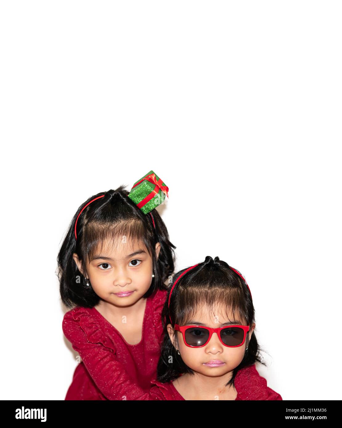 Two asian little child girls hugging each other with love in white ...