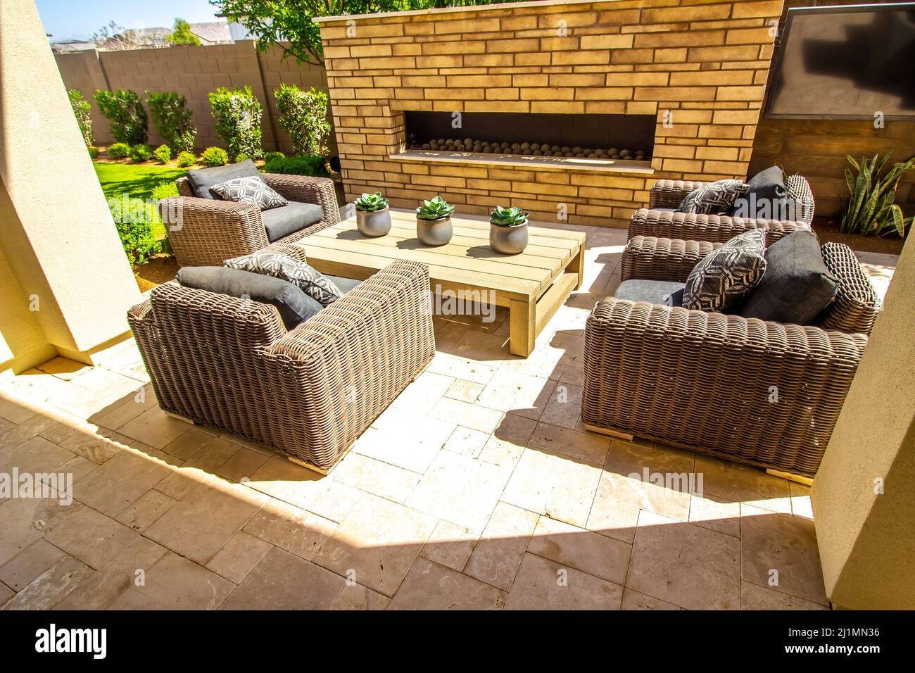 Four Oversize Wicker Chairs In Rear Yard Setting Stock Photo - Alamy