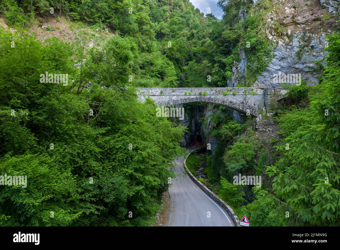 A bridge crosses the road  Strada della Forra, Tremosine, Lake Garda, Lombardy, Italy, Europe Stock Photo