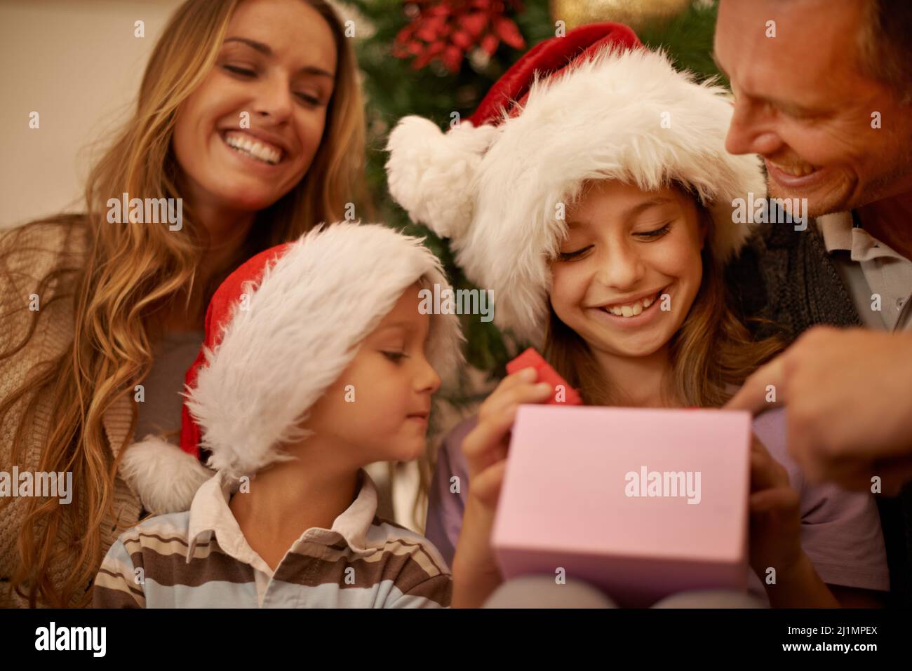 Christmas is the best time of year. A little girl receiving a Christmas