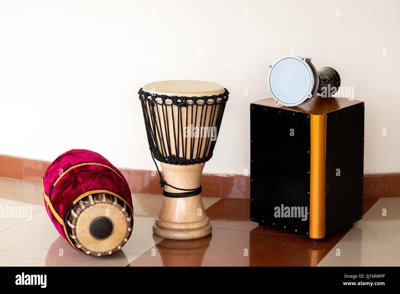 The percussion instruments mridangam djembe Cajon and goblet drum or darbuka drum Stock Photo