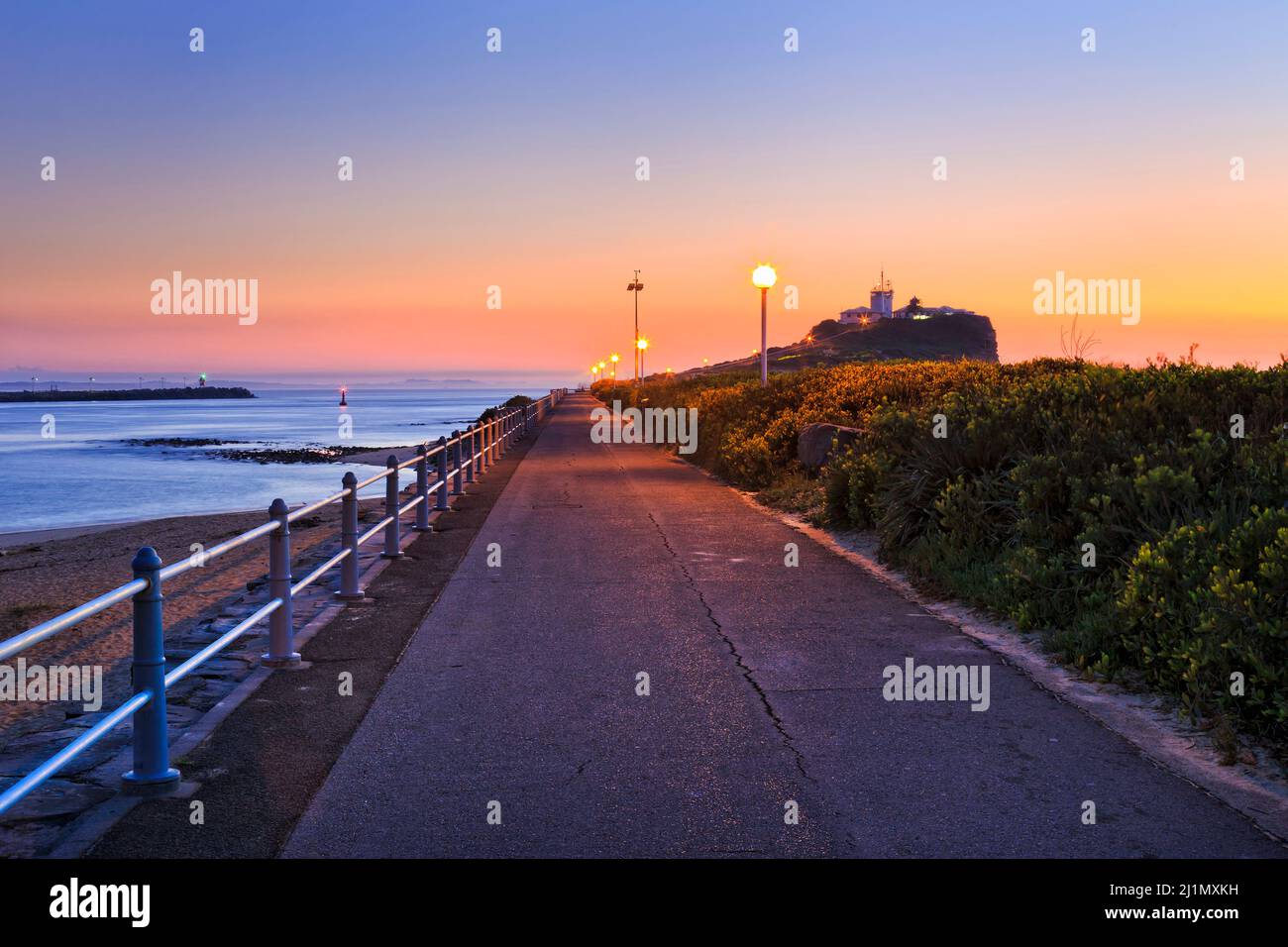 Delta of Hunter river in Newcastle city of Australia at sunrise near Nobbys head and lighthouse. Stock Photo