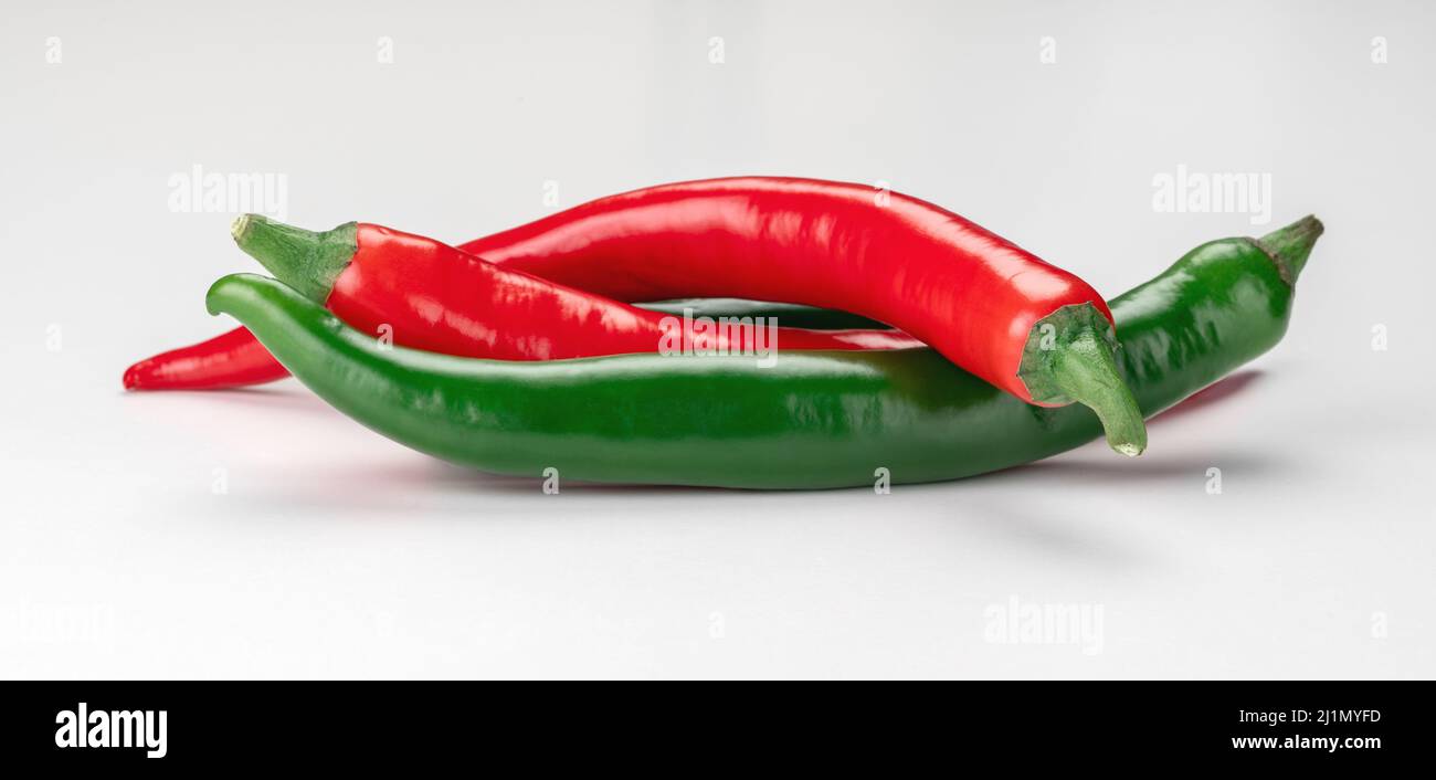 three Ripe chili pepper isolated on white background. red and green hot ...