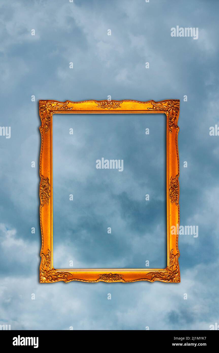 empty ornate, golden picture frame in the sky Stock Photo