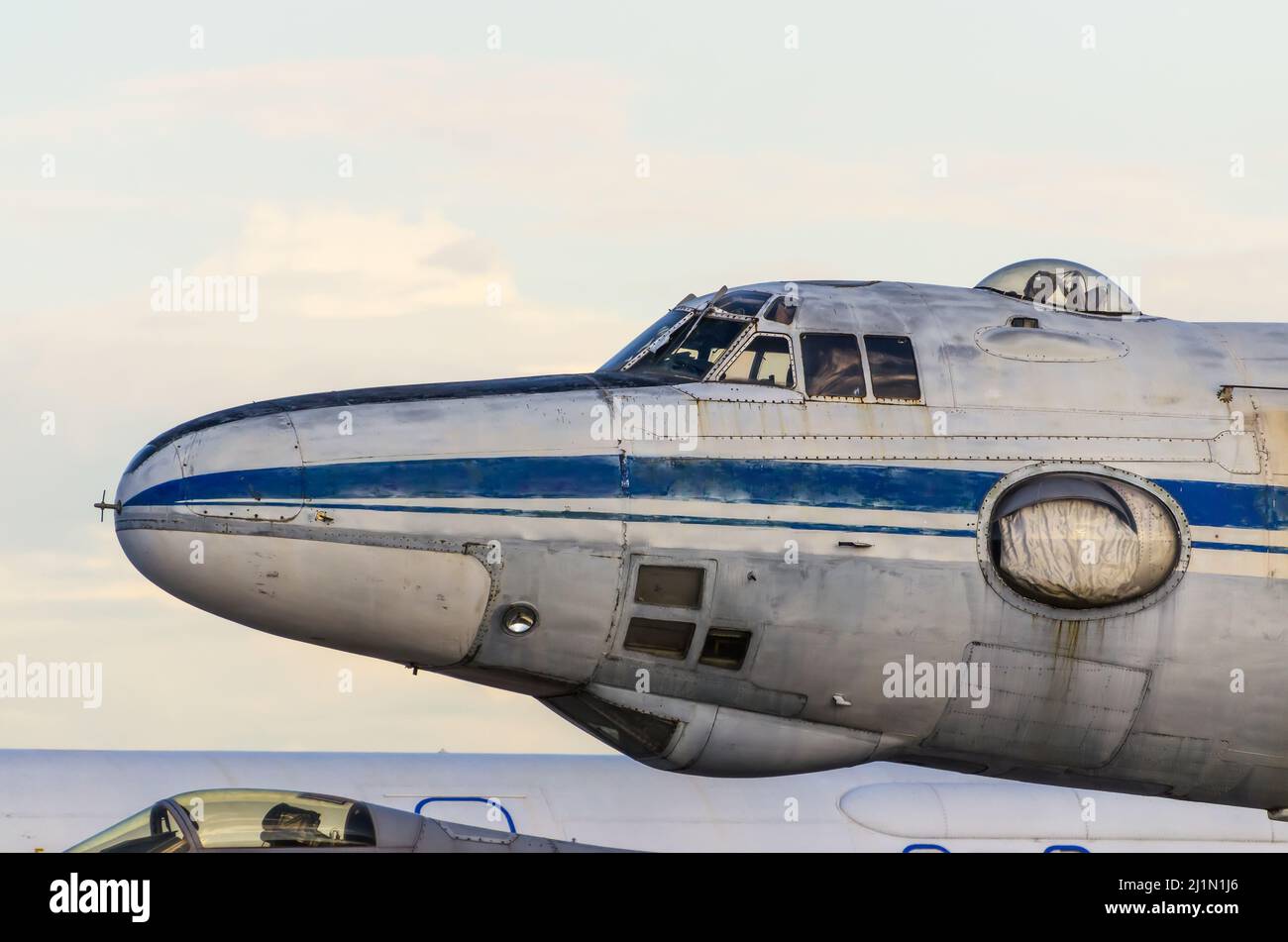 Old plane parked at the airport, view of the nose Stock Photo - Alamy