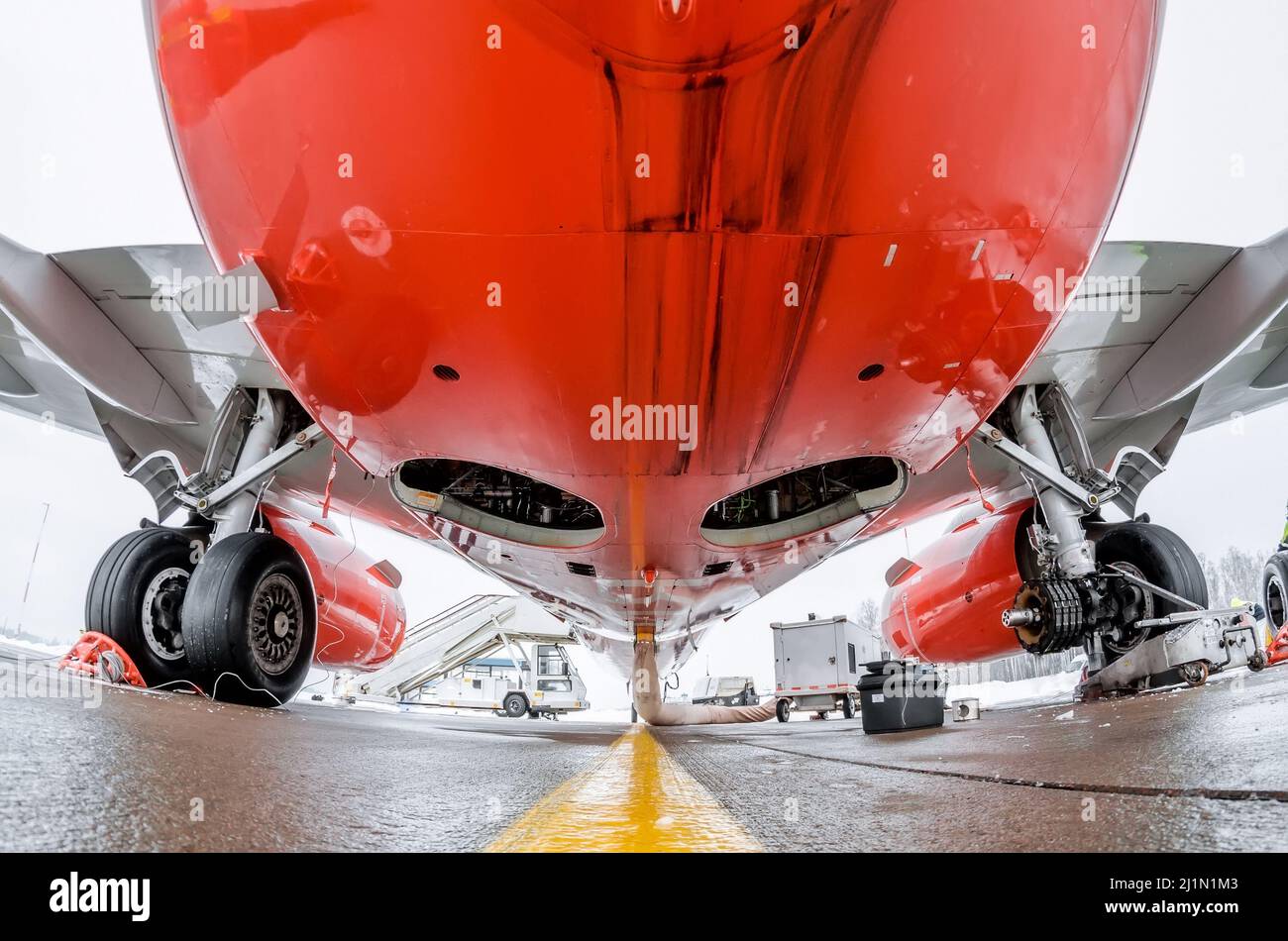 Airplane fuselage and main landing gear repair, bottom view close up