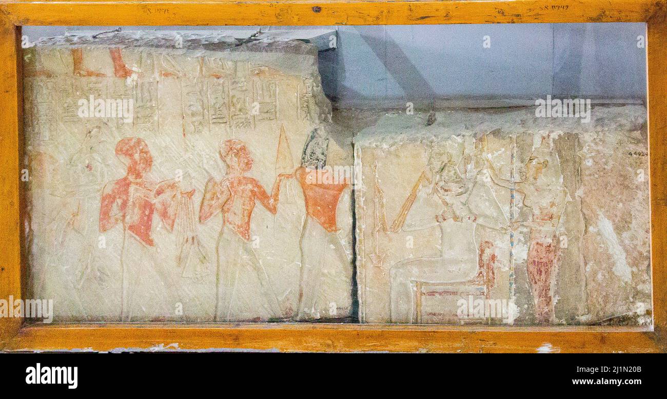 Cairo, Egyptian Museum, from Saqqara, offering bringers before Osiris and Isis. Stock Photo