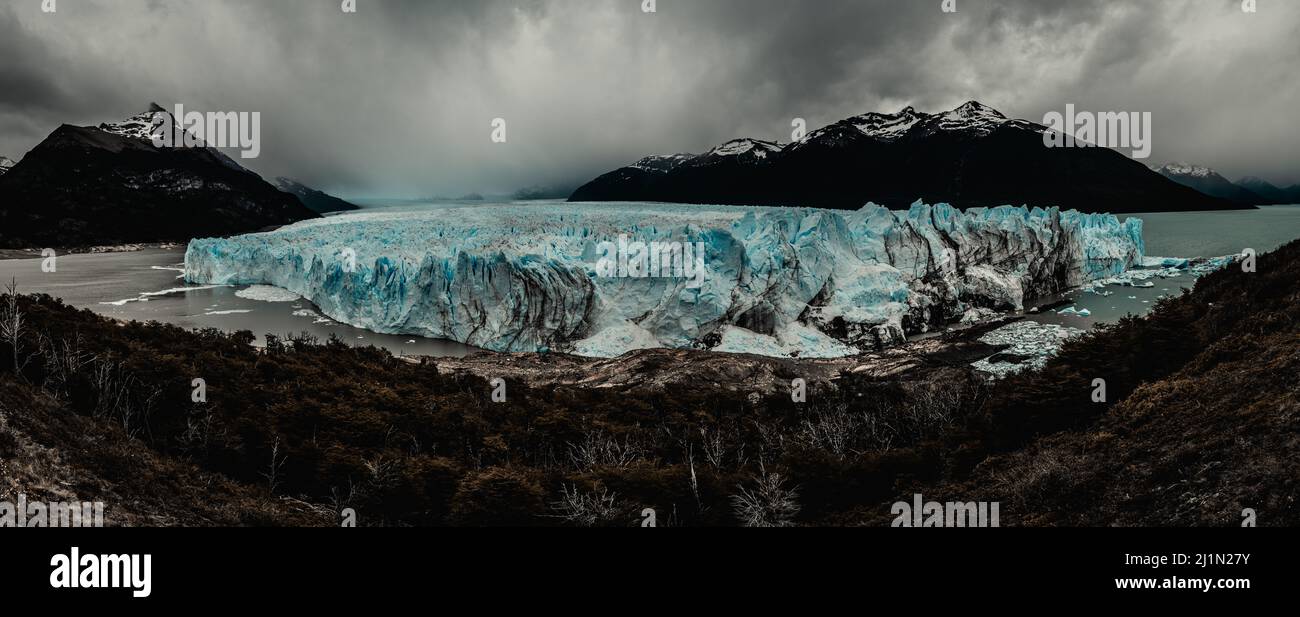 A dramatic photo of the landscape surrounding the world famous Perito Moreno glacier in Argentine Patagonia. Dark Cloudy adn rainy  weather Stock Photo