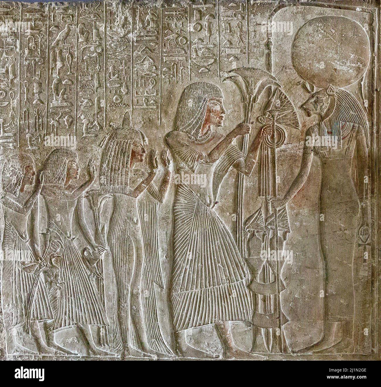 Cairo, Egyptian Museum,  relief of the tomb of Amenemonet. New Kingdom, from Saqqara. Deceased and his family before goddess Sekhmet in shrine. Stock Photo