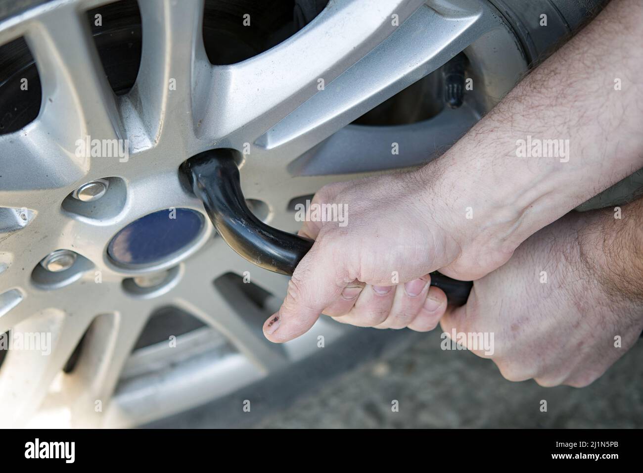 changing flat tire on the road. A close up Stock Photo