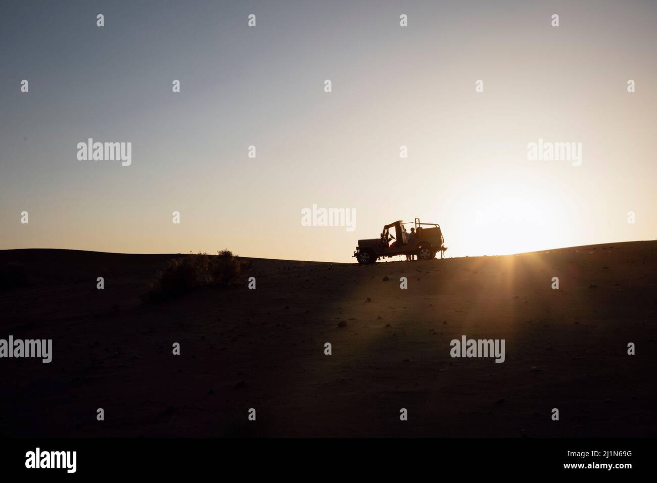 Jeep, Car, sunset, safari, Sand Dunes, Desert National Park, Jaisalmer, Rajasthan, India Stock Photo
