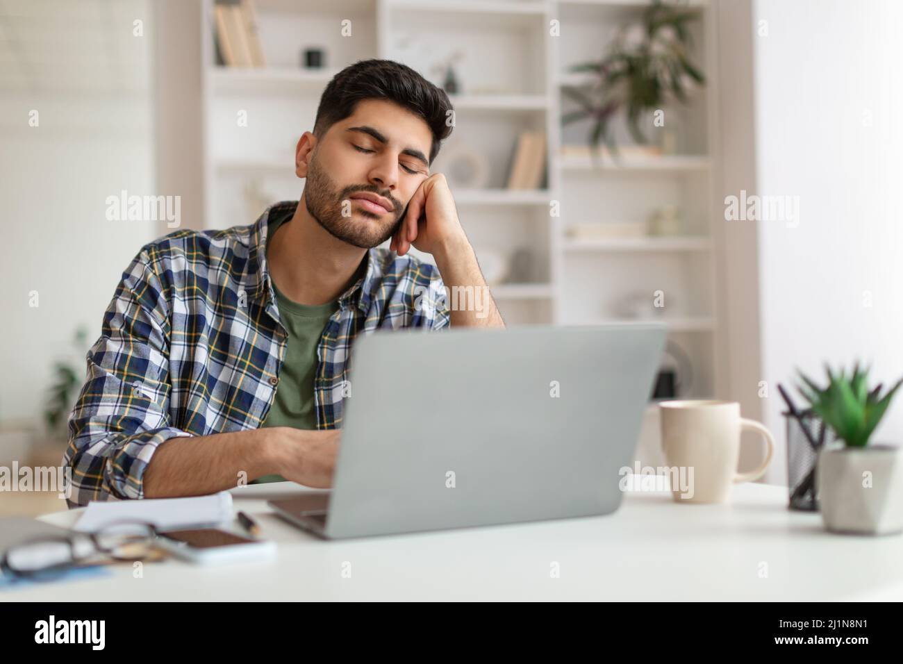 Exhausted Young Man Sleeping At Work Sitting At Desk Stock Photo Alamy
