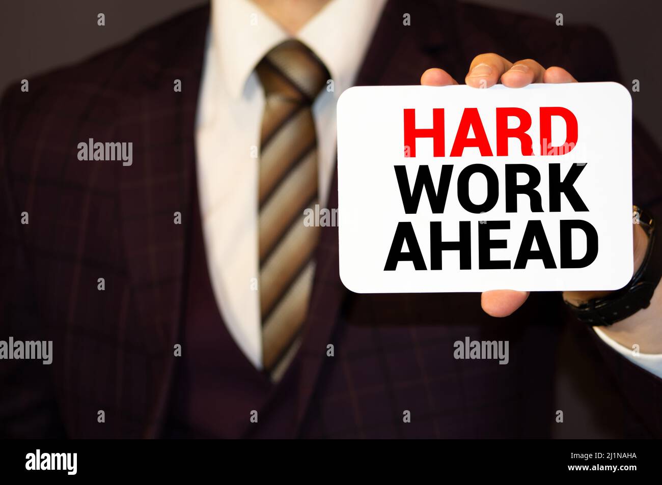 Red Hard work ahead warning sign with copy space. Business concept on Hard work for successful in career. Making a motivative decision on the future b Stock Photo
