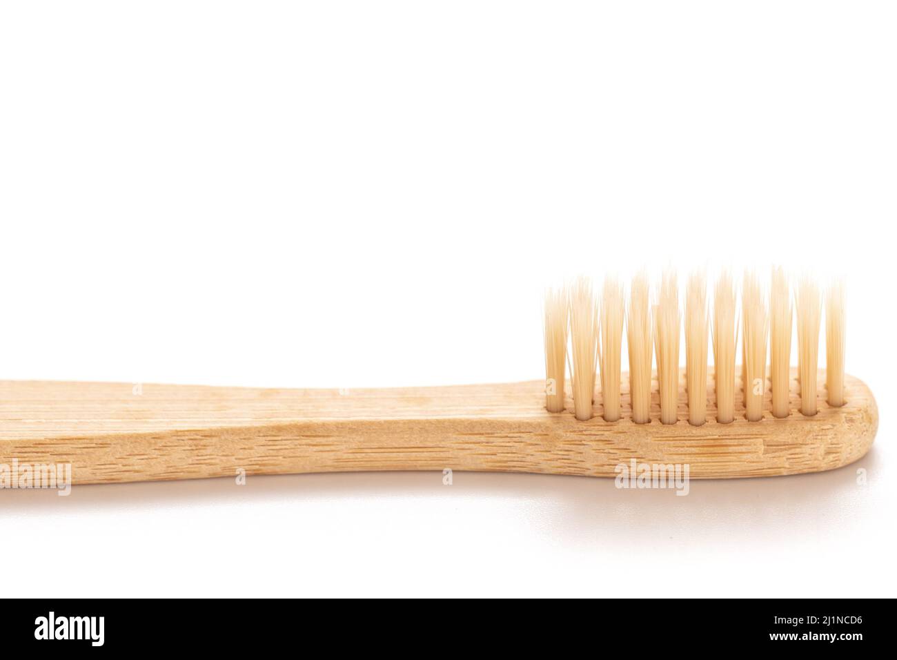 Eco friendly bamboo toothbrush on white background Stock Photo - Alamy