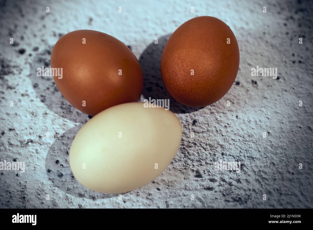 Easter composition. Three eggs on a gray background Stock Photo
