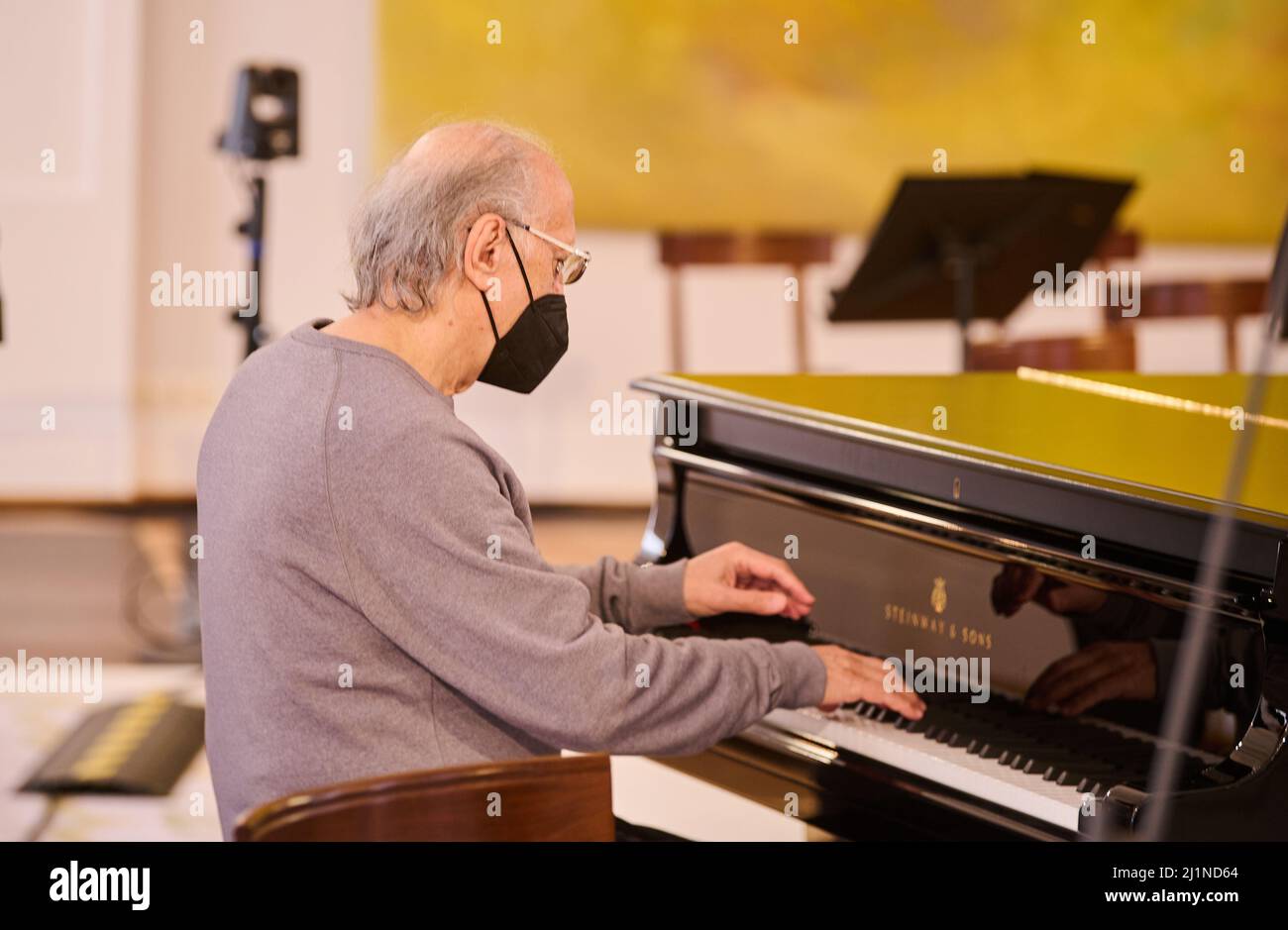 Berlin, Germany. 27th Mar, 2022. Ukrainian composer Valentin Silvestrov  sits shortly before the concert "For Freedom and Peace. A concert by the  Berlin Philharmonic Orchestra at Bellevue Palace" at the piano. Federal