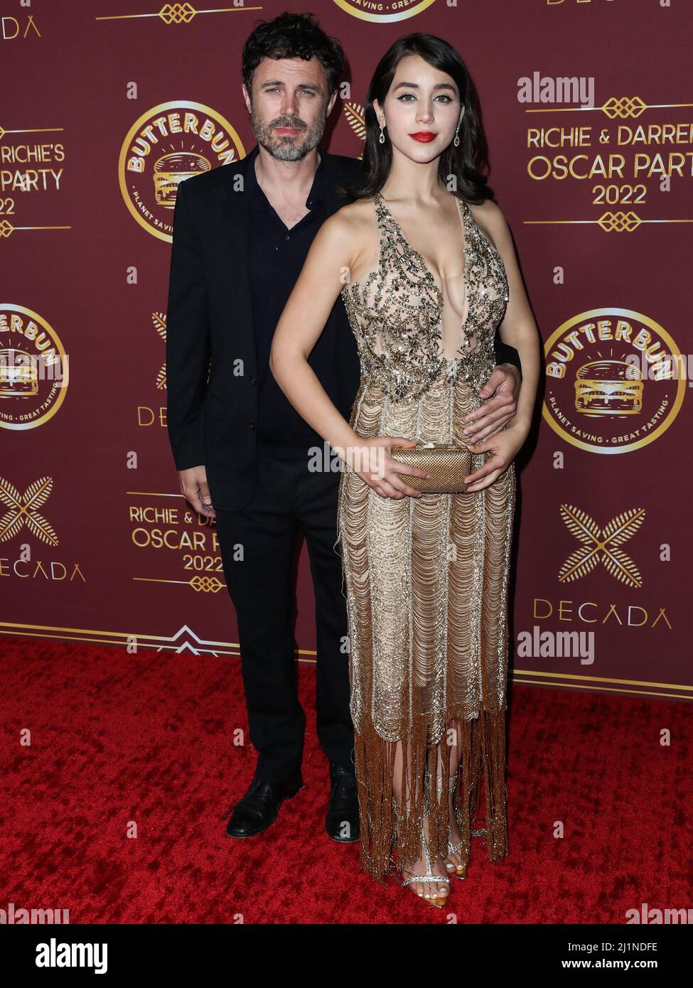 Caylee Cowan and Casey Affleck hold hands as they step out for