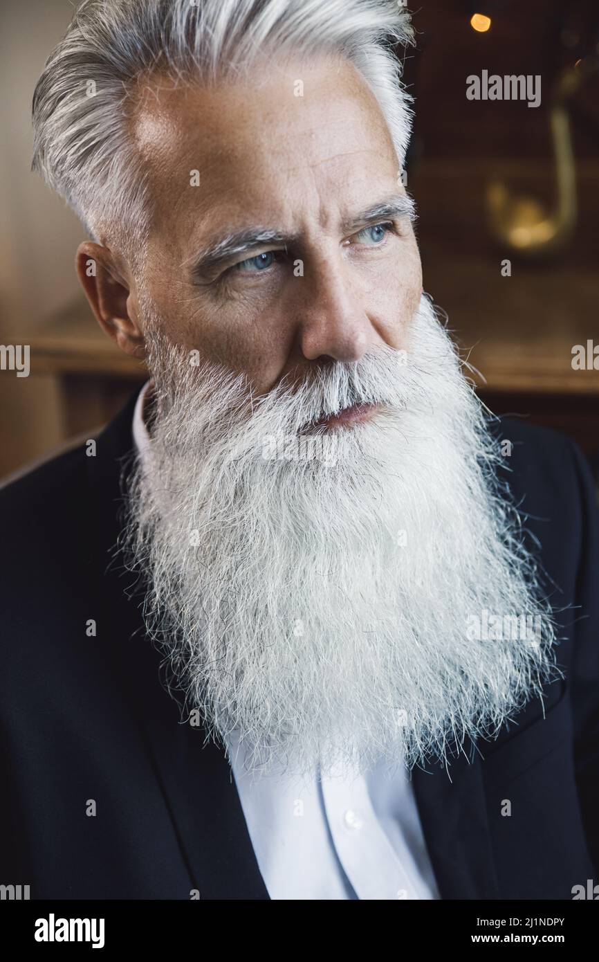Handsome bearded senior man posing in studio Stock Photo
