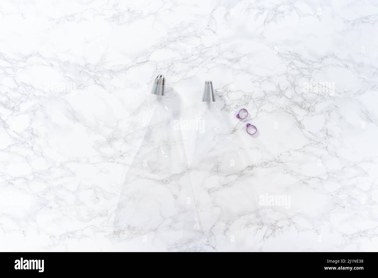 Flat lay. Piping bags with jumbo metal piping tips filled in with Jumbo