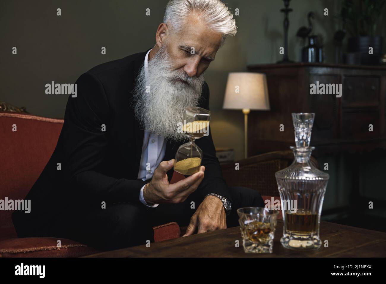 Old bearded man and clock hi-res stock photography and images - Alamy