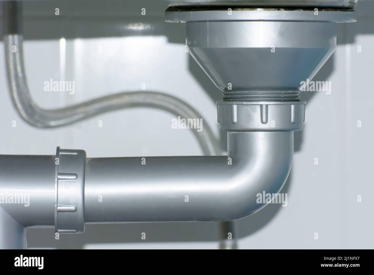A closeup of a drainage pipe under a kitchen sink Stock Photo Alamy