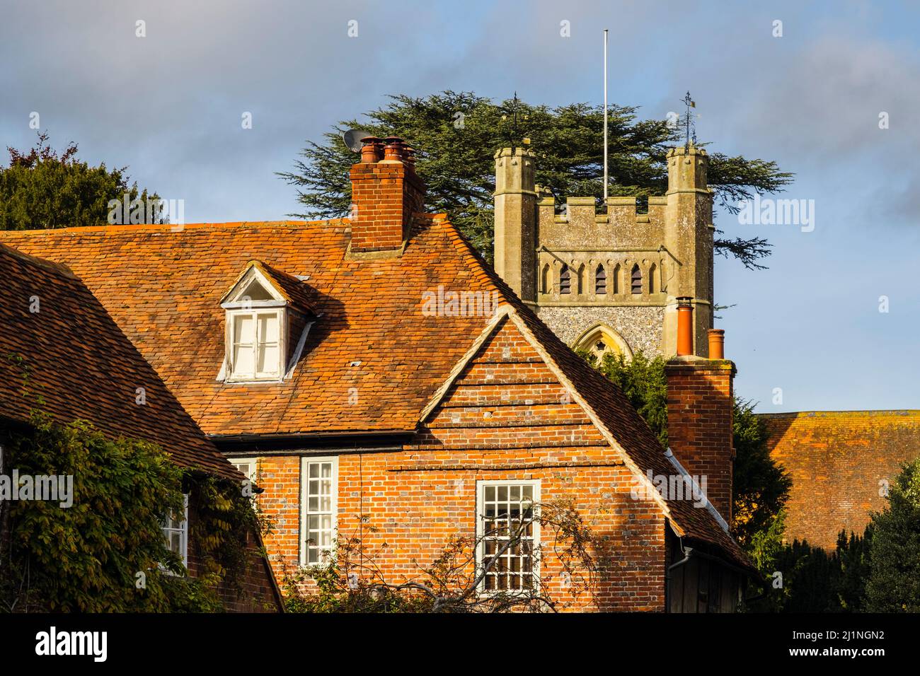 Period cottages and 14th century St Mary the Virgin church tower in historic rural Chilterns village. Hambleden, Buckinghamshire, England, UK, Britain Stock Photo