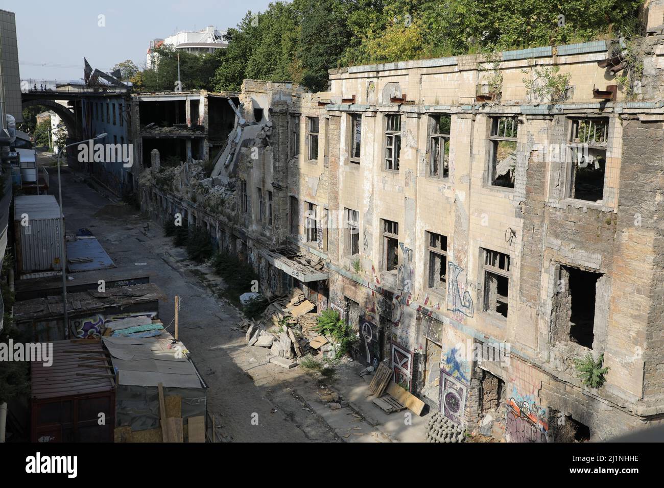Street view of Devolanivskyi Descent (Spusk) in Odesa, Ukraine with a bridge in the background; some derelict buildings & casino are being torn down Stock Photo