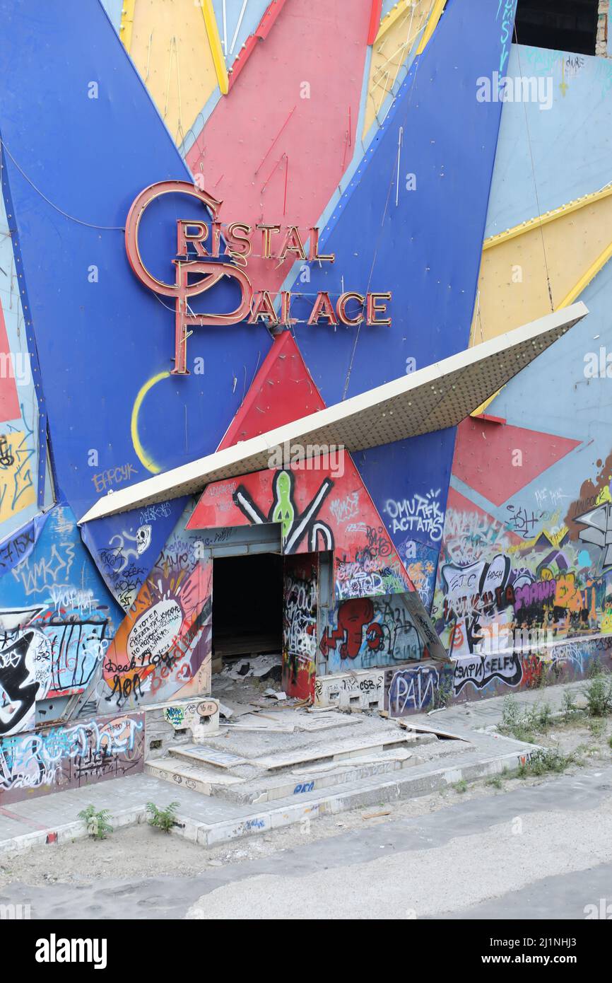 Entrance of the old, dilapidated, abandoned casino Cristal Palace in the Devolanovskiy descent in Odessa, Ukraine; there is graffiti on the wall Stock Photo