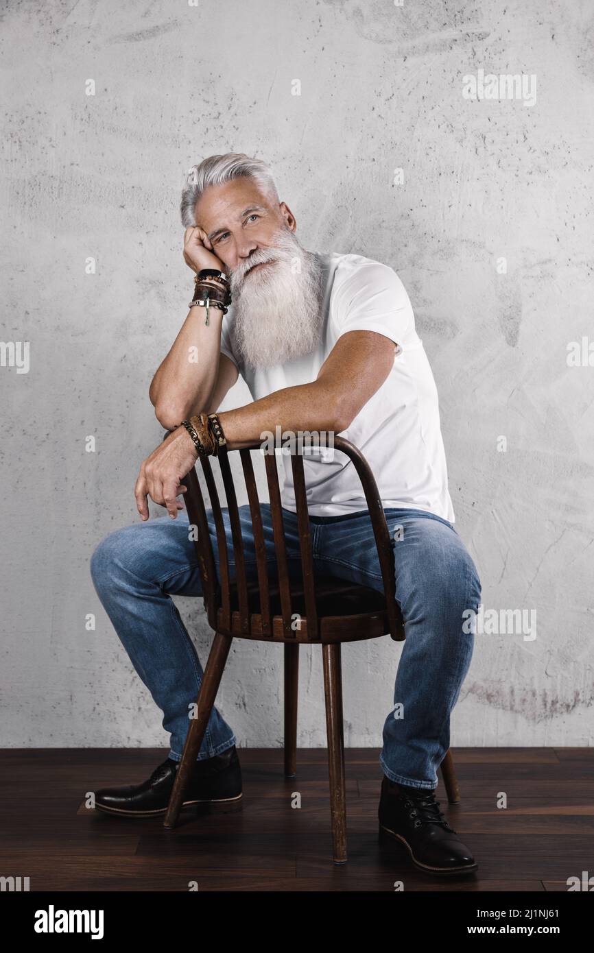 Handsome bearded senior man posing in studio Stock Photo