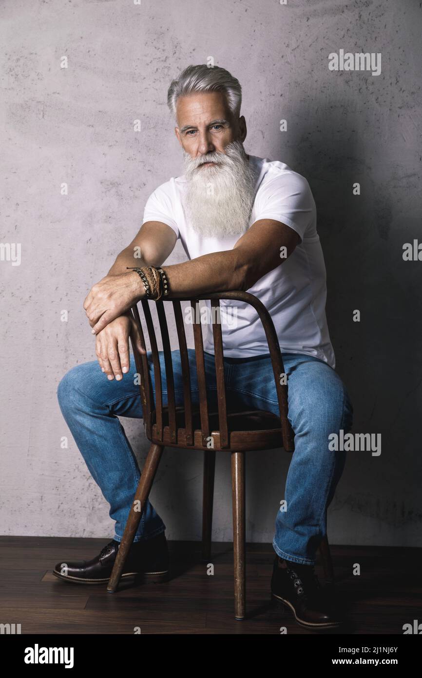 Handsome bearded senior man posing in studio Stock Photo