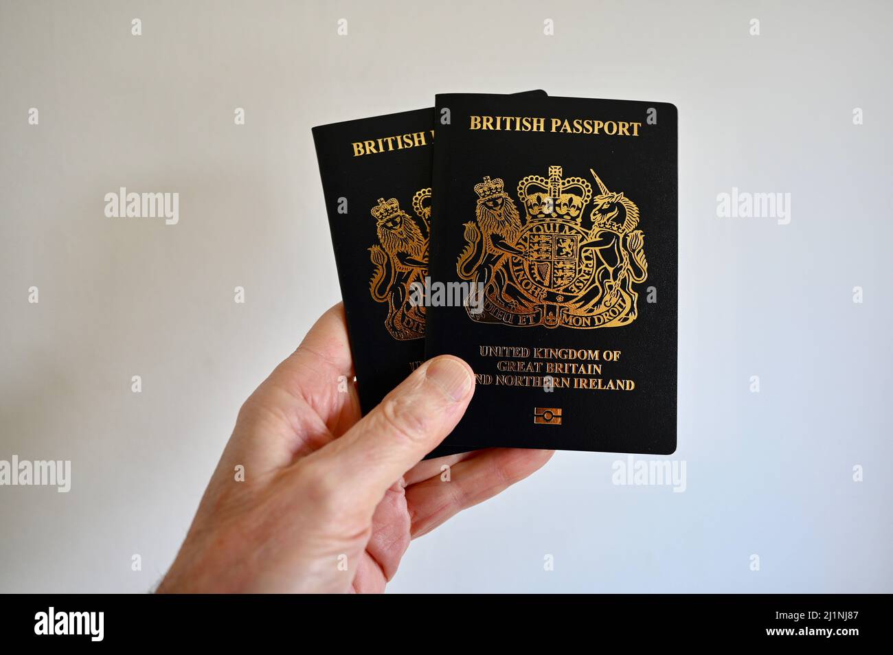 Close-up of two navy blue British passports. Stock Photo