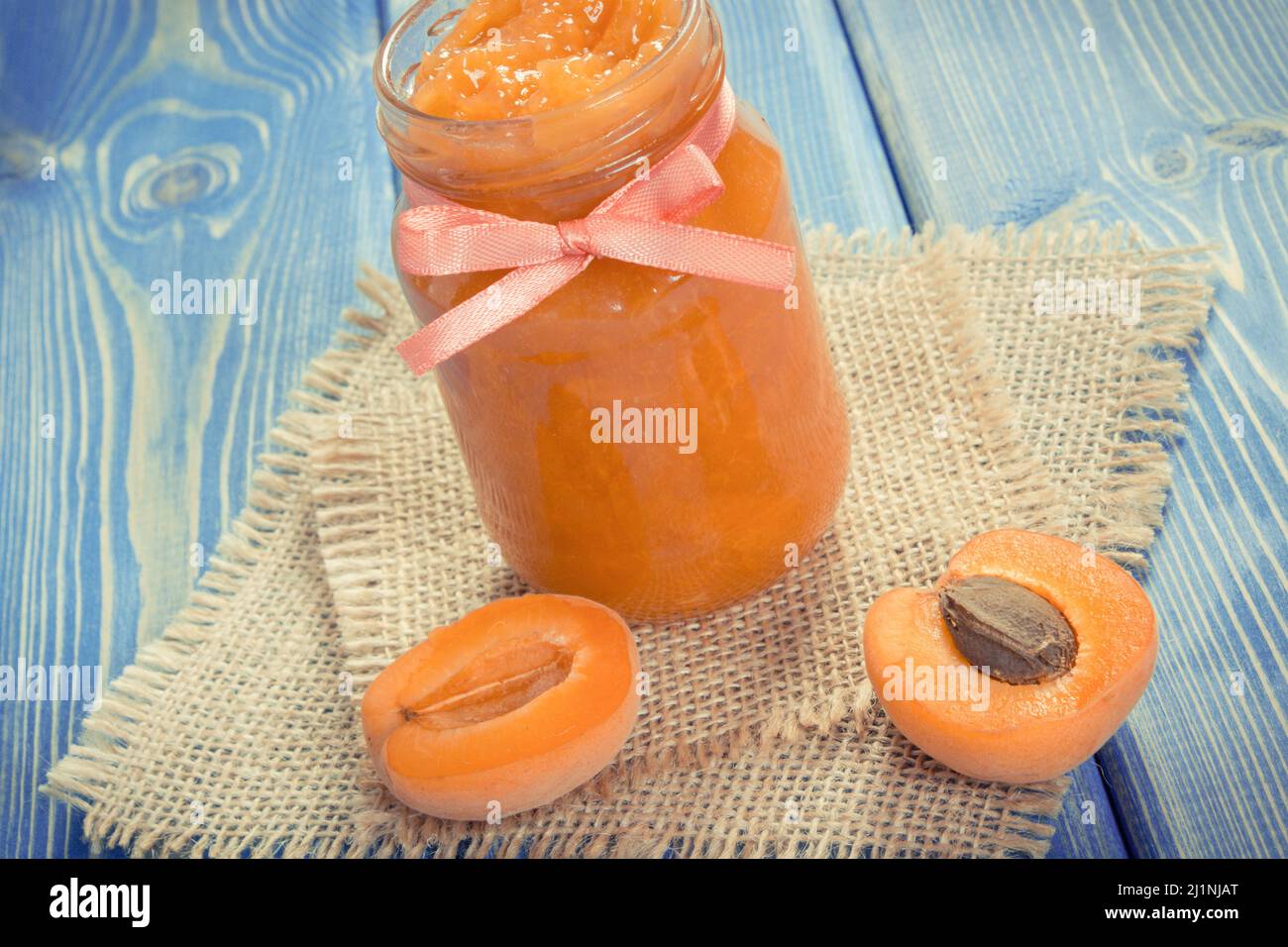 Fresh homemade apricot marmalade and ripe fruits, concept of healthy sweet dessert Stock Photo