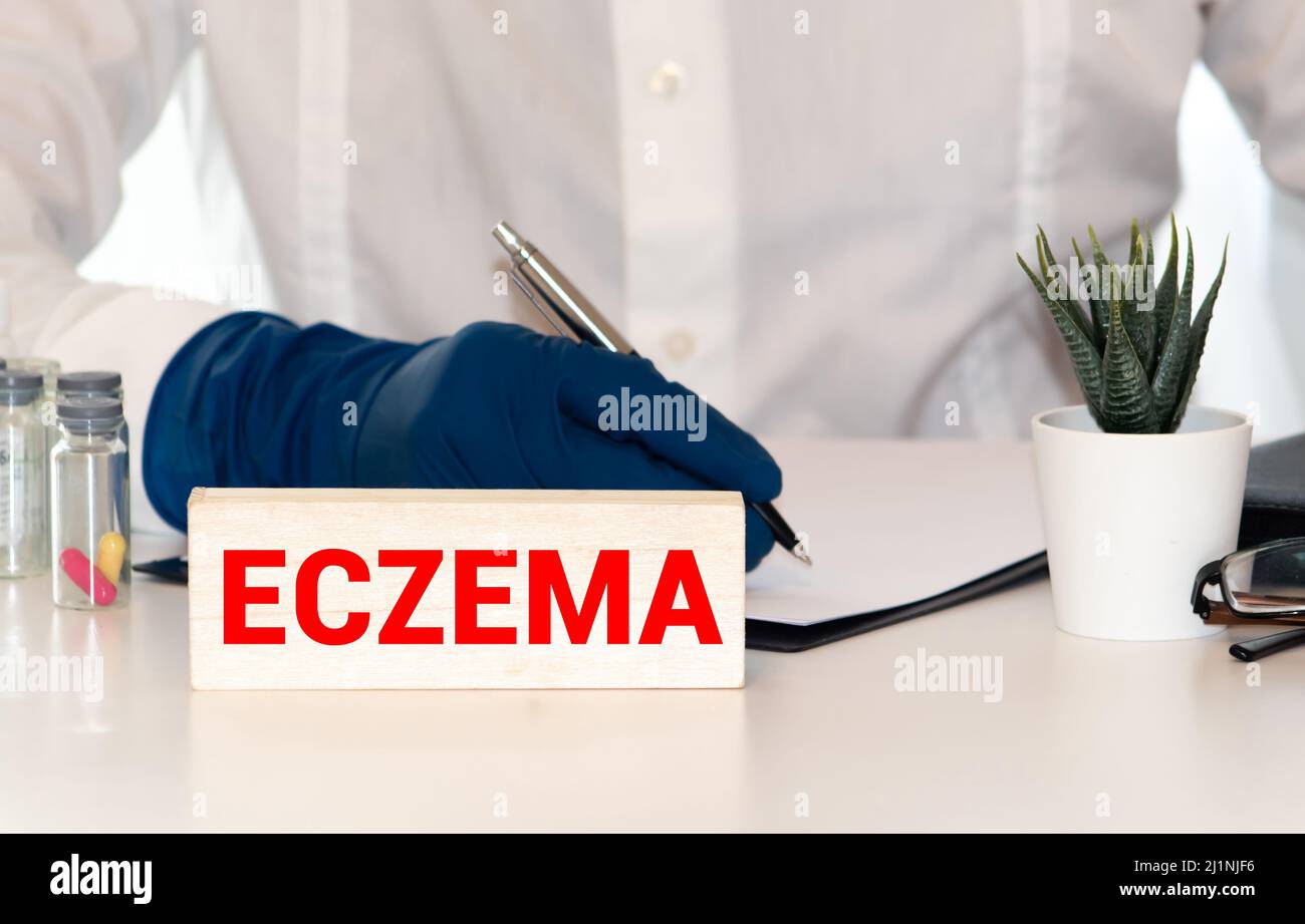 Eczema - Doctor with chalkboard on white background Stock Photo
