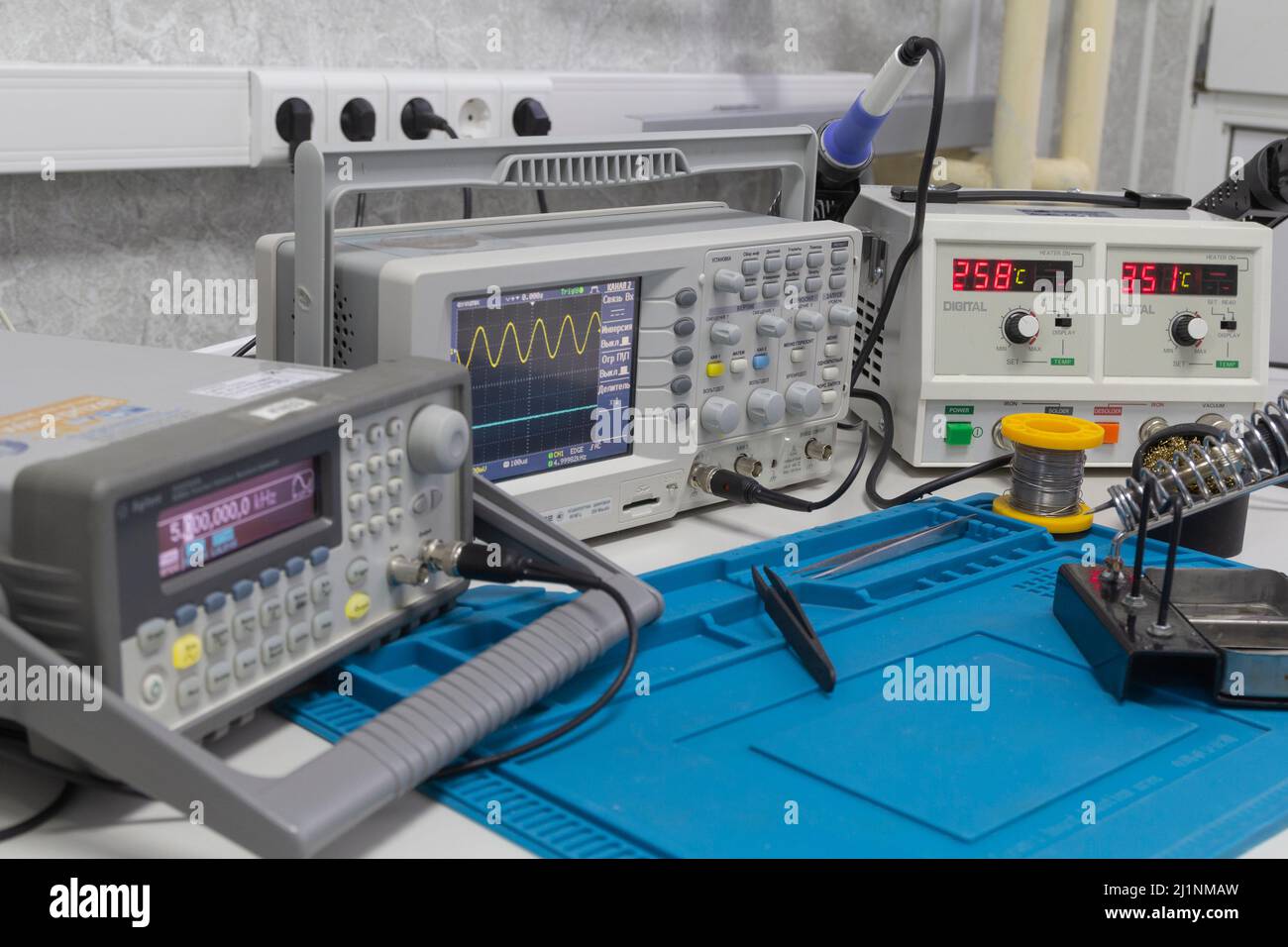 Power supplies and electronic measuring devices in the laboratory.Electronic measuring instruments in science lab. Stock Photo