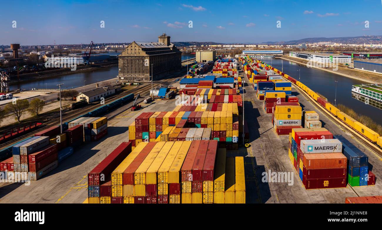 industrial port with containers in Danube river. Many much cargo waitng for shipping in port. Stock Photo