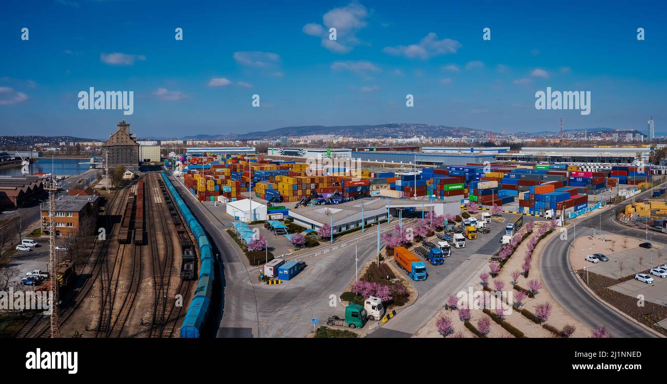 industrial port with containers in Danube river. Many much cargo waitng for shipping in port. Stock Photo