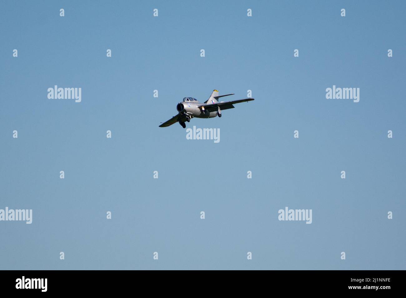 Czech Mig-15UTI 'Midget' OK-UTI2514 vintage jet plane landing with flaps deployed at NATO Days air show. Stock Photo