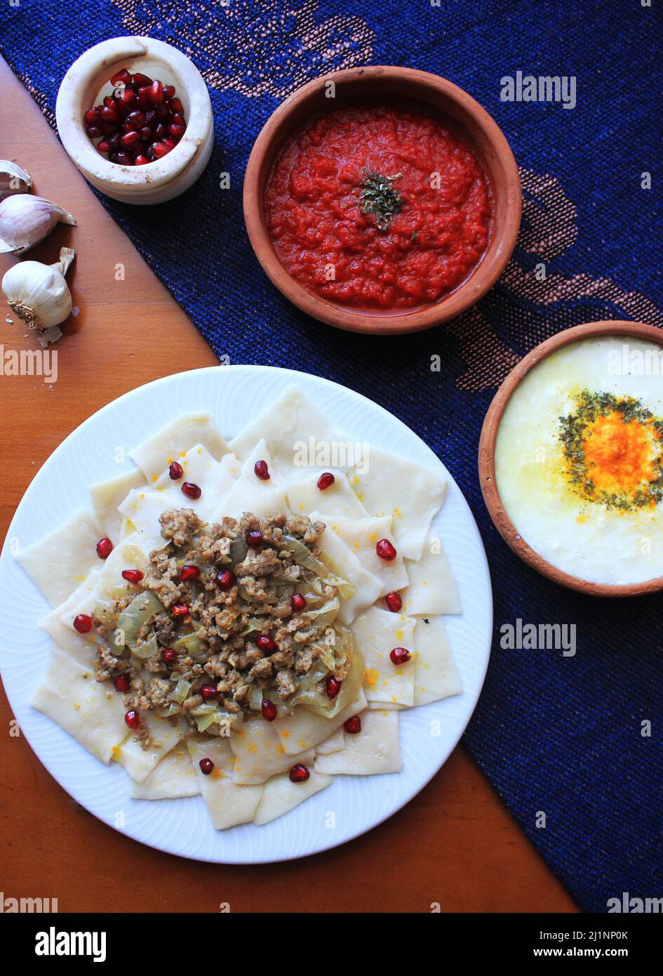 Azerbaijani Khingal (Handmade Noodles with Ground beef and Yogurt Sauce) Stock Photo