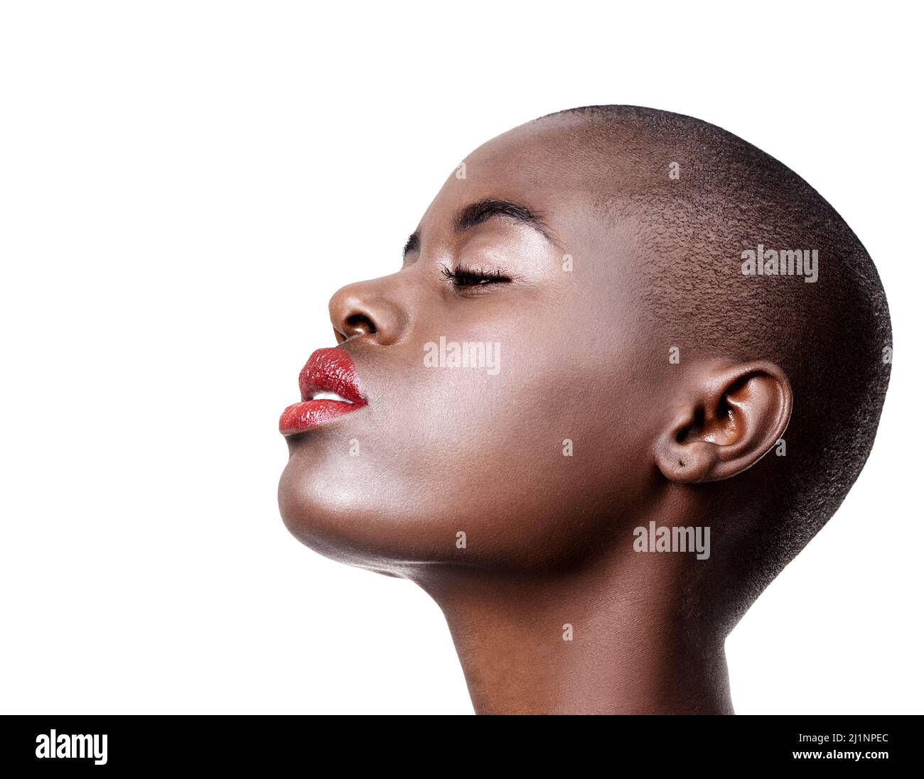 Make up is self-confidence applied directly to the face. Studio shot of a beautiful young african woman wearing red lipstick isolated on white. Stock Photo
