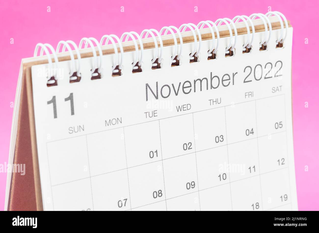 The October 2022 desk calendar on pink background with empty space. Stock Photo