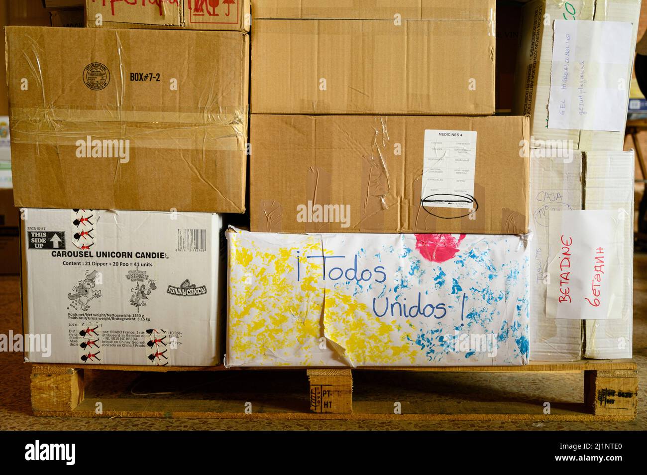 March 26, 2022, Seville, Seville, Spain: Boxes full of medicines as  humanitarian aid to Ukraine, one of the boxes with the Ukrainian colors  reads ''all together''. A warehouse in the FIBES center