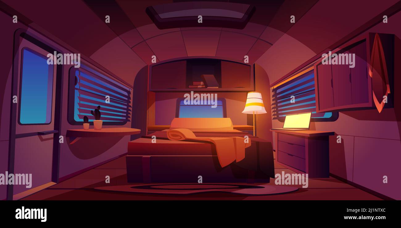Camping trailer car interior with bed and glowing floor lamp at night