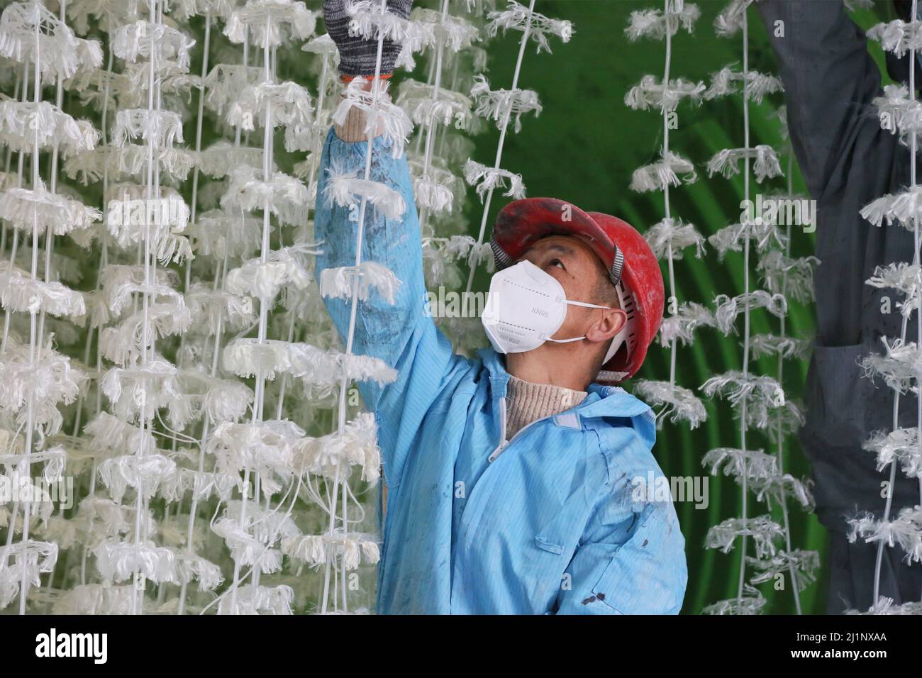 HAI'AN, CHINA - MARCH 27, 2022 - A worker installs a combined packing and aeration system inside a sewage treatment facility in Hai 'an, East China's Stock Photo
