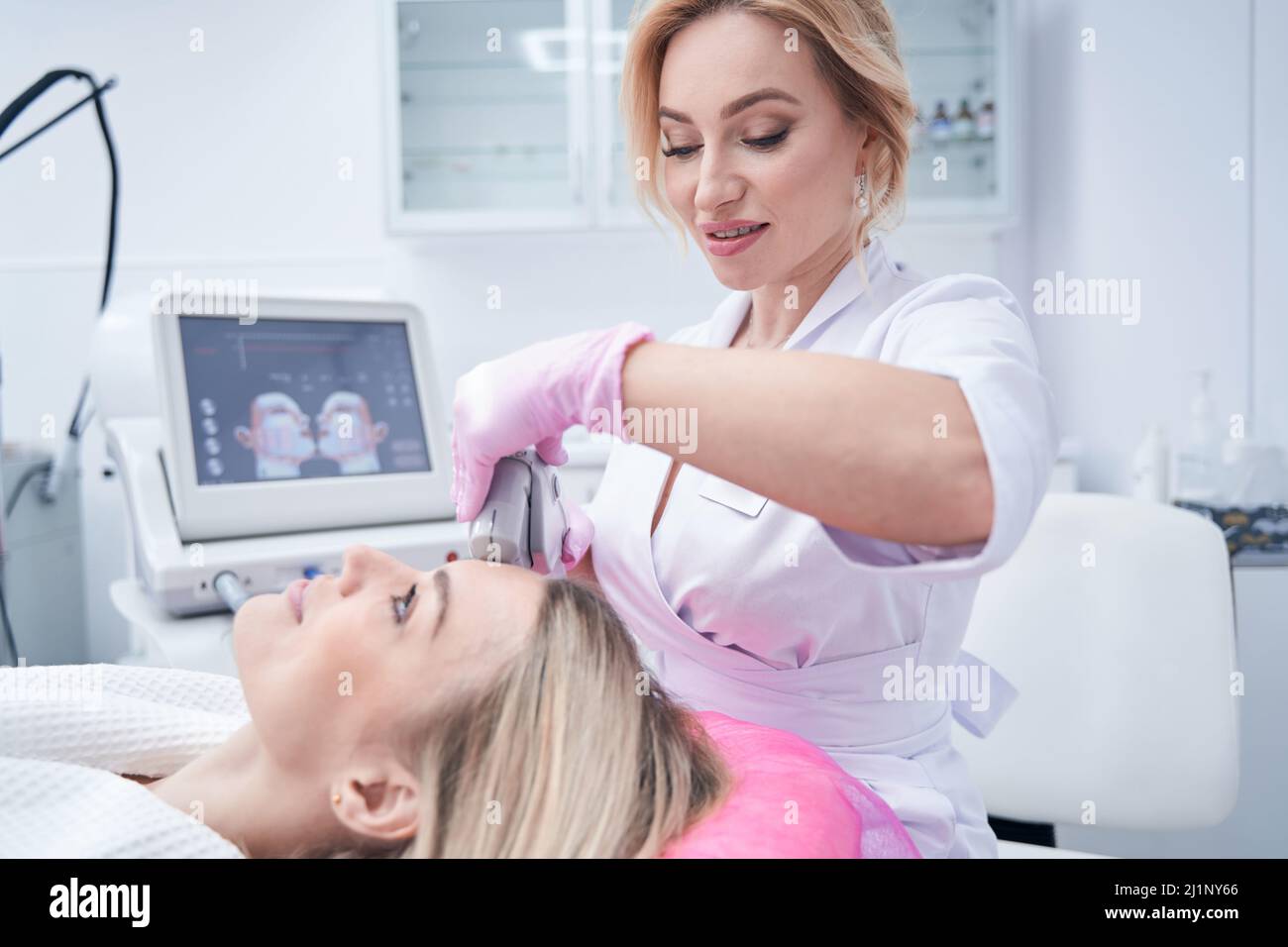 Dermatologist performing skin tightening hi-res stock photography and ...