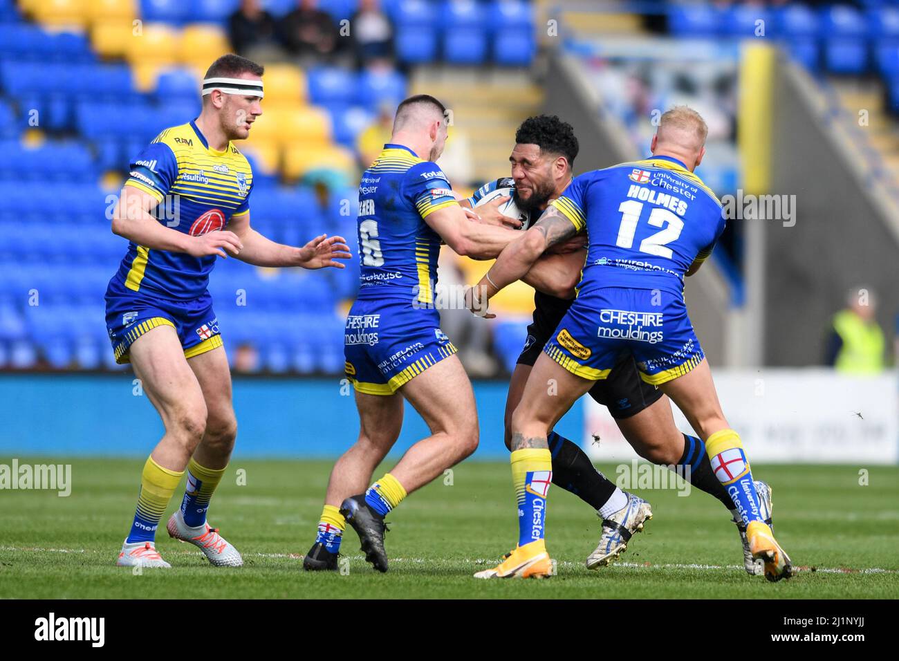 Kelepi Tanginoa #12 of Wakefield Trinity is tackled by Oliver Holmes #12 and Danny Walker #16 of Warrington Wolves  in Warrington, United Kingdom on 3/27/2022. (Photo by Simon Whitehead/News Images/Sipa USA) Stock Photo