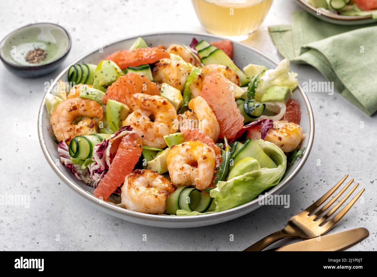 Healthy salad with shrimp prawns, grapefruit, avocado, cucumber and