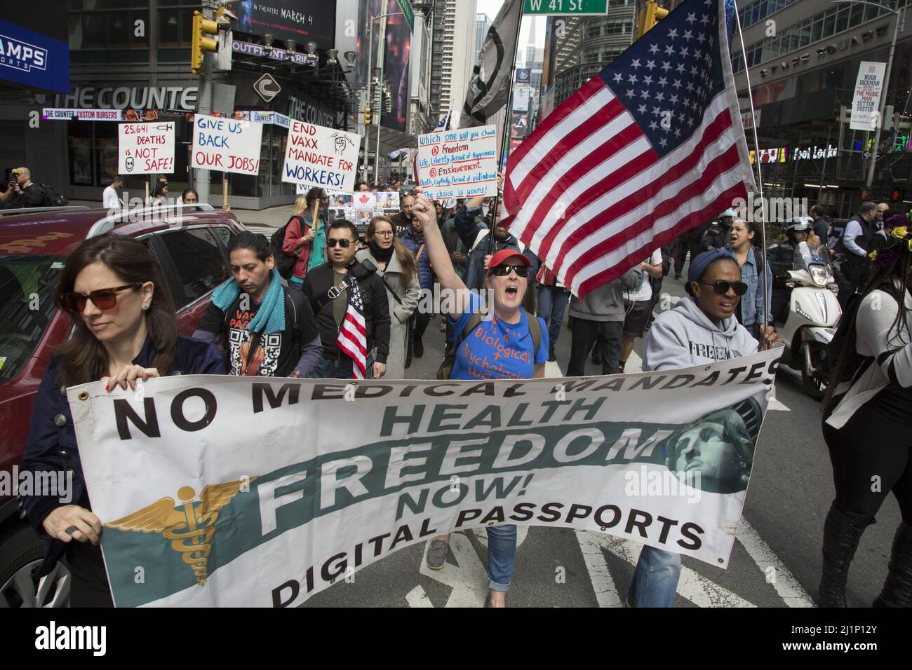 Energetic people in the 'Medical Freedom, No Vaccine Mandate' movement rally and march in New York City and other cities on March 19, 2022. Stock Photo