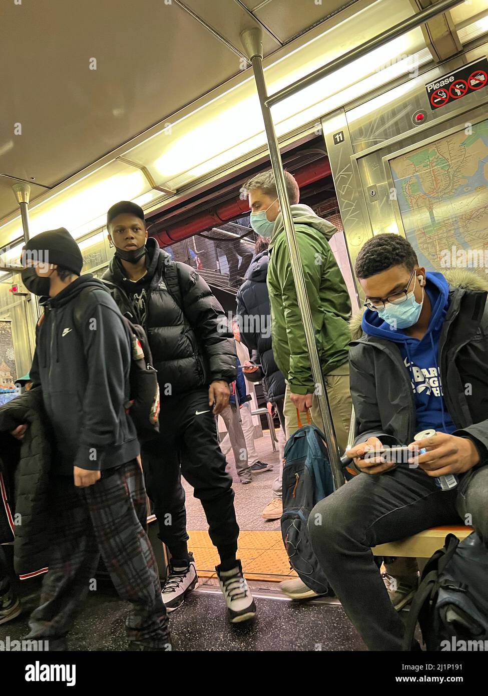 Riders board an R subway train to Bay Ridge, Brooklyn, New York. Stock Photo