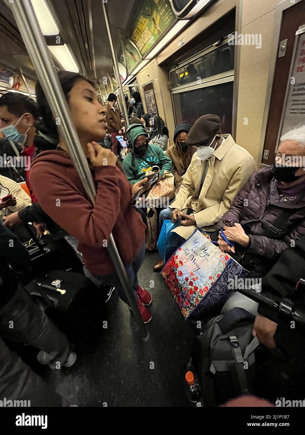 New York City subway trains are crowded again during rush hour where there is no more social