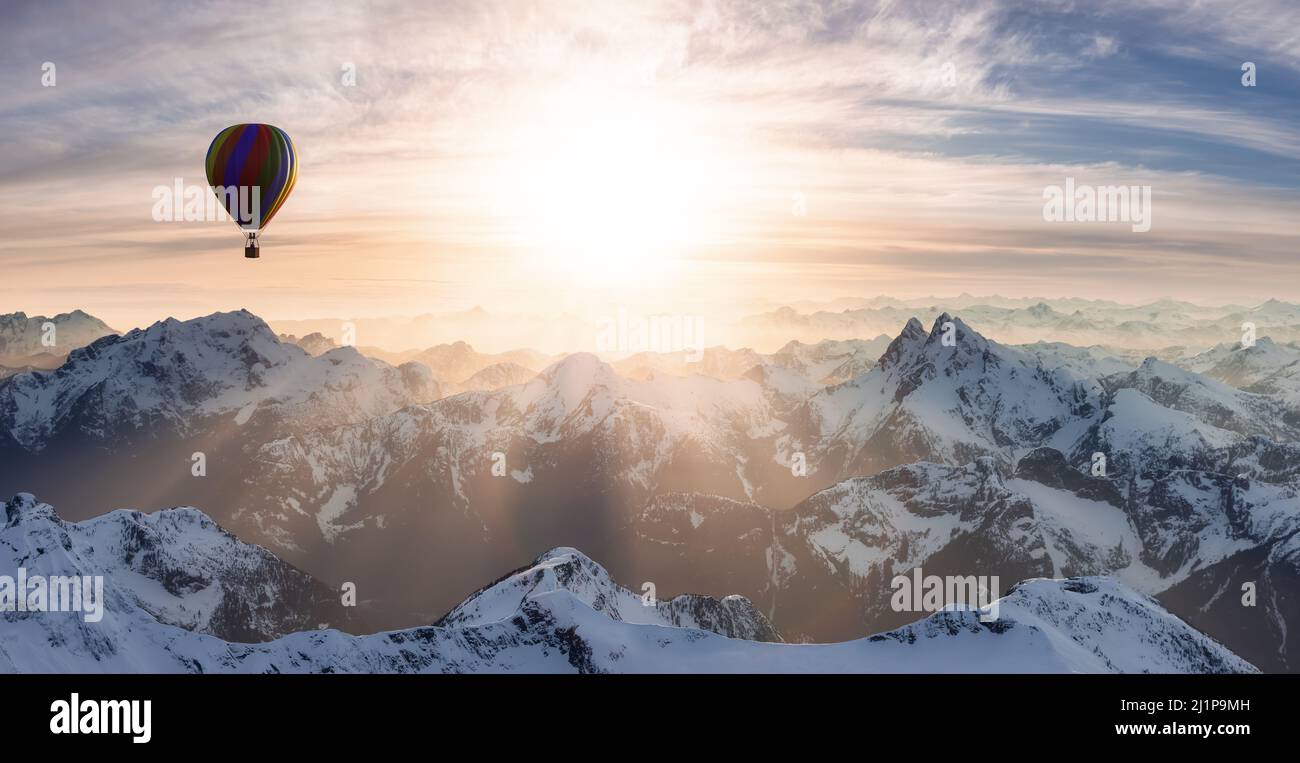 Dramatic Mountain Landscape covered in clouds and Hot Air Balloon ...